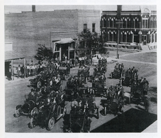 A photo of a collection of old-timey buggys.
