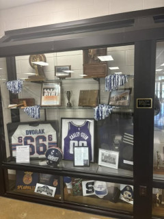 Case containing notable athletes' memorabilia. 